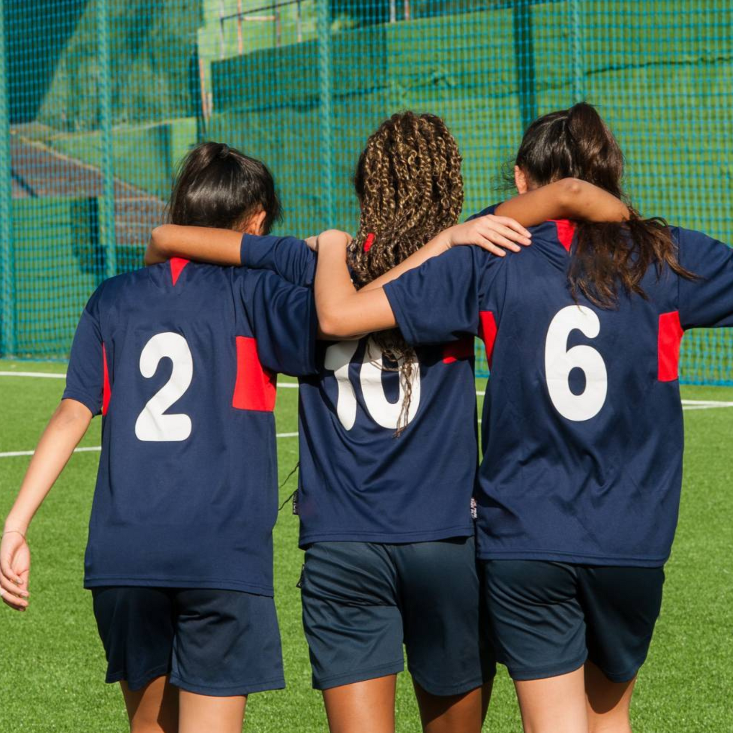 teen girls in soccer uniforms