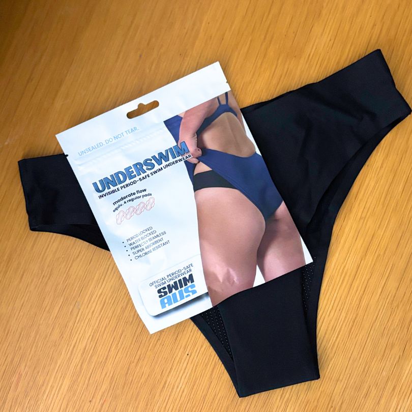 Packaged black UnderSwim OG period swim underwear